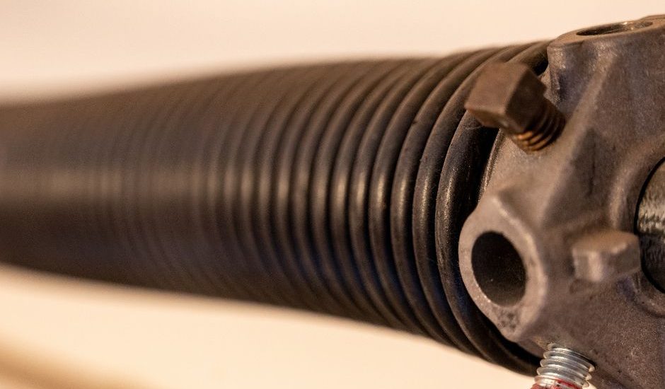 Close-up view of a garage door spring system.