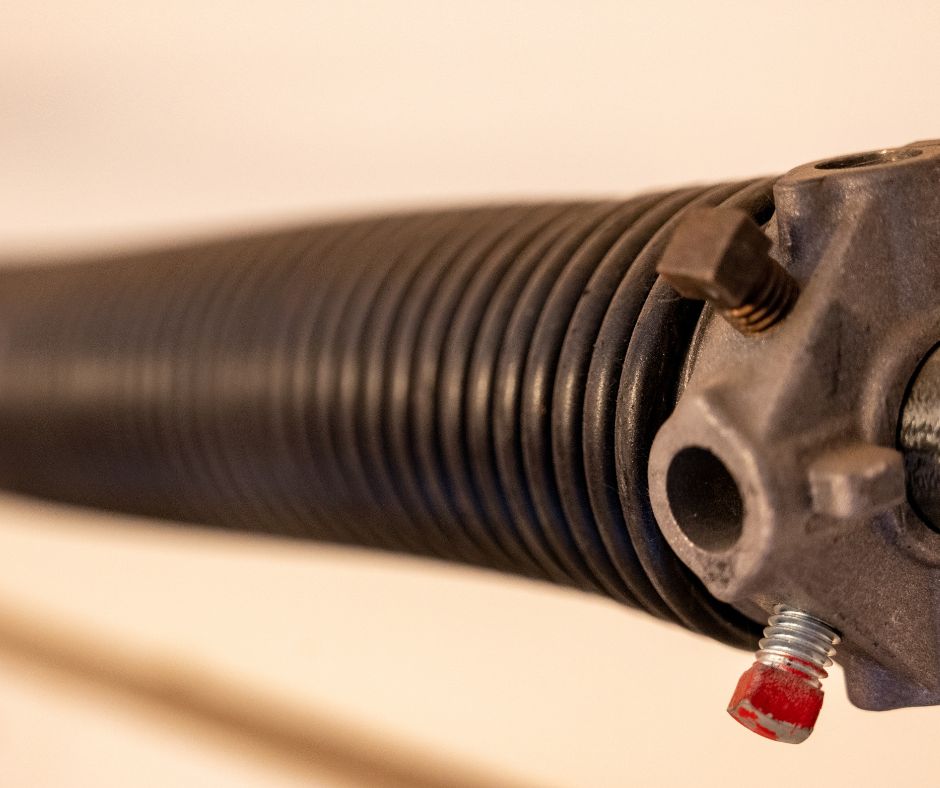 Close-up view of a garage door spring system.