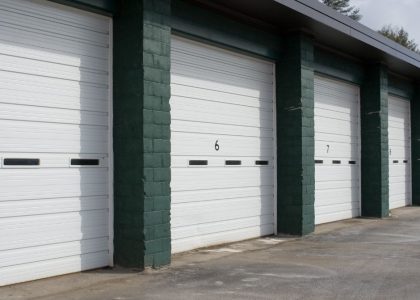 A sleek commercial garage door with the Bulldog Garage Door Repair logo.