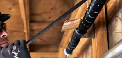 man fixing garage door spring
